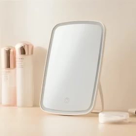 Desktop sensor makeup mirror with daylight illumination